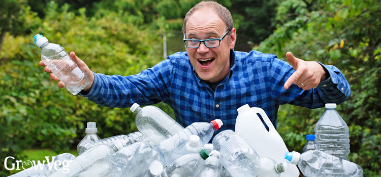 Ben with a big pile of plastic bottles